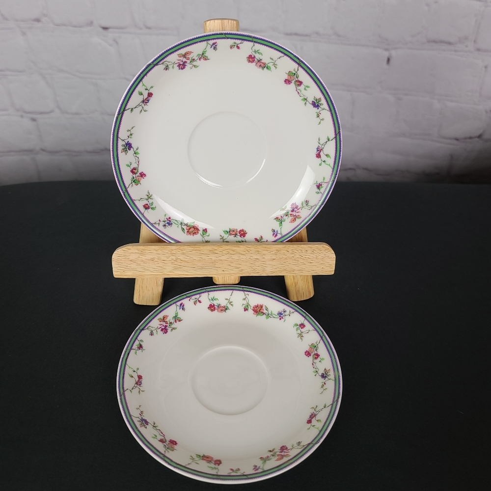Bernardaud  Haviland Limoges Floral design on white 2 Saucers.